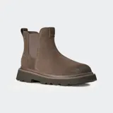 Botas tipo Chelsea de gamuza color marrón, con paneles laterales elásticos, lengüeta trasera y suela de plataforma dentada.