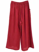 Pantalon ancho color bordo de lino con cintura elástica fruncida y detalle de botones en los tobillos.