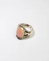 Anillo de plata 925 con dublé de oro, zirconias blancas y piedra rosa ovalada.