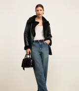 Pantalón baggy de jeans con cintura alta, bolsillos delanteros y traseros y lavado dirty.