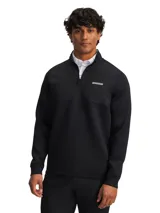 Campera deportiva Under Armour Drive Pro Hybrid de golf, color negro, con media cremallera y cuello alto. Diseño híbrido con aislamiento en el pecho y cuello, y tejido elástico transpirable en mangas y cuerpo.