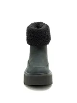Bota de caña baja Cat modelo Colorado Max Roll Do, de color negro. Está confeccionada en nubuck con suela gruesa de goma dentada y plataforma, y cuenta con un borde superior con forro de corderito sintético negro.
