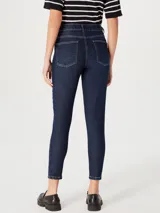 Pantalón de jean ajustado (skinny) de tiro medio, color azul claro con efecto lavado.