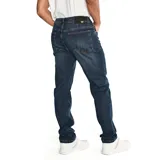 Jeans de denim azul con calce slim, diseño clásico de cinco bolsillos, cierre de cremallera y botón, y costuras en contraste.