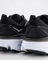 Championes de running Hoka One One Bondi 8, color negro con logo blanco en el lateral y suela gruesa en dos tonos.