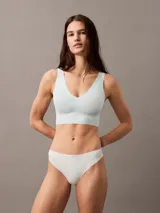 Colaless celeste de microfibra suave con bordes cortados a láser, talle medio y logo de Calvin Klein estampado en la cadera.