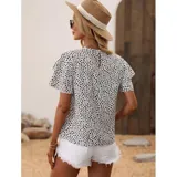 Blusa de manga corta con estampado de puntos negros sobre fondo blanco. Presenta un diseño de corte suelto con mangas que incluyen volados superpuestos y cuello redondo.