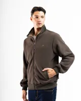 Campera de polar azul con cierre frontal completo y cuello alto. Presenta puños y cintura con elástico acanalado. Tiene un pequeño logo bordado en el pecho.