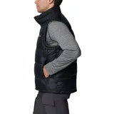Chaleco acolchado Columbia de color negro con cierre frontal completo, cuello alto y tecnología Omni-Heat™ para retención de calor. Cuenta con bolsillos laterales con cierre y logo de la marca bordado en el pecho.