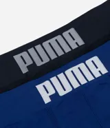 Kit de dos calzoncillos tipo boxer sin costuras de la marca Puma, confeccionados en poliamida, con cintura elástica con lettering y pequeño logo en la pierna. Incluye una unidad en azul y otra en negro.