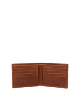 Billetera de cuero natural color caramelo con costuras a la vista y logo de la marca grabado en la esquina inferior derecha. Cuenta con tecnología RFID para protección de datos.