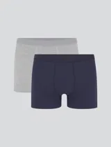 Pack de dos calzoncillos bóxer largos, uno negro y otro azul marino, confeccionados en algodón y elastano, con elástico personalizado en la cintura.