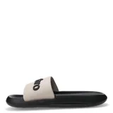 Chanclas Umbro modelo Twise, con base negra y banda superior en color beige con el logo de la marca en relieve negro.