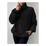 Buzo de polar con textura suave, color beige, con cuello alto y cierre frontal parcial. Diseño de manga larga y calce holgado.