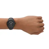Reloj Armani Exchange modelo Dante, con caja y malla de acero inoxidable color negro. Esfera negra con detalles plateados y logo AX.