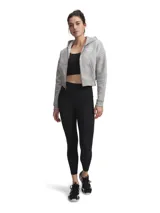 Calza deportiva de tiro alto con bolsillos laterales, confeccionada en tejido elástico de alto rendimiento con tecnología que absorbe el sudor y se seca rápidamente.