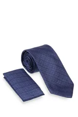 Corbata verde oscuro con estampado floral y pañuelo de bolsillo a juego.