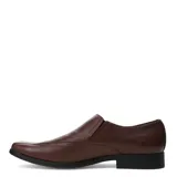 Zapato de vestir tipo slip-on color negro, confeccionado en cuero, con punta cuadrada y costuras decorativas en el empeine.