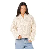 Buzo de polar con cierre frontal parcial, cuello alto y mangas largas. Presenta un estampado geométrico y de soles en tonos beige y blanco.