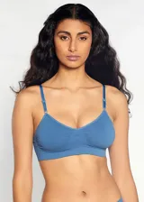 Soutien tipo top de microfibra sin costuras, sin aros ni copas, con breteles regulables.
