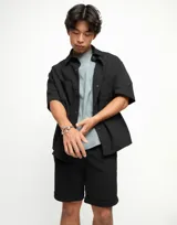 Pulsera rígida plateada con tres bolas en aleación de metales bañadas en plata de ley.