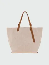 Mini bolso cruzado de Longchamp, diseñado con la estética de un par de manoplas de lana verde con franjas blancas y bordó, y solapa de cuero marrón con cierre de broche a presión.