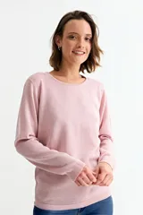 Sweater de punto con acabado brillante, cuello redondo y mangas largas con puños acanalados.