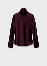 Camisa de cuello alto y manga larga, confeccionada en tejido satinado de corte recto con cierre de cremallera en la parte posterior.