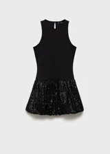 Vestido corto con cuerpo entallado sin mangas y cuello redondo, combinado con una falda estilo globo con acabado de lentejuelas brillantes.