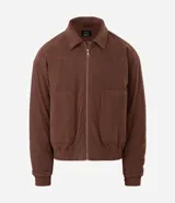 Campera bomber de pana color marrón, con cuello polo, cierre frontal con cremallera y puños y bajo elásticos.