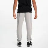 Pantalón de jogging negro con puños elásticos, cordón ajustable en la cintura, escudo del Club Atlético Peñarol bordado en amarillo y franjas laterales amarillas y grises.