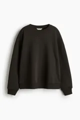 Buzo de tejido liso, color negro, con cuello redondo, hombros caídos y puños y bajo acanalados.