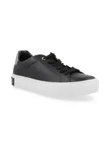Zapatillas urbanas Hush Puppies de cuero negro con suela de goma blanca y detalle de marca en el talón.