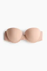 Soutien balconette push-up de microfibra color beige, con aros y copas acolchadas. Incluye tirantes ajustables y removibles, y cierre posterior con corchetes.