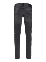 Jean de corte slim fit con tiro bajo, confeccionado en denim elástico de color gris oscuro con efecto lavado. Presenta diseño clásico de cinco bolsillos, cierre frontal con botón y costuras reforzadas.