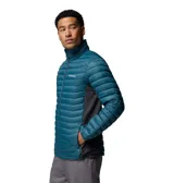 Campera técnica híbrida de Columbia, diseñada para actividades al aire libre. Presenta un cuerpo acolchado con aislamiento térmico en color azul petróleo y paneles laterales de tejido elástico en color gris oscuro para mayor movilidad. Cuenta con cierre frontal completo, cuello alto y bolsillos laterales con cierre.