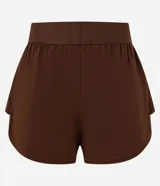 Short deportivo runner de la marca Get Over, color blanco, con cintura ancha elástica y bajo redondeado.
