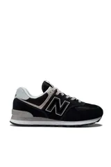 Championes deportivos New Balance modelo 574, color verde con detalles en gris y blanco, confeccionados en gamuza y malla, con el logotipo "N" característico en los laterales y entresuela ENCAP.