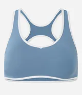 Top deportivo de microfibra con diseño de espalda nadador, escote redondo y bies en color blanco a modo de contraste. Cuenta con copas desmontables para mayor soporte y ajuste.