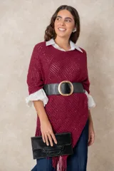 Cinturón ancho tipo faja, confeccionado con una banda elástica negra y paneles de cuero italiano en la parte frontal. Presenta una hebilla metálica circular de gran tamaño con acabado dorado brillante.