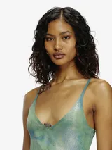 Vestido mini de tirantes finos color naranja con estampado difuminado en blanco.