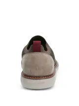 Zapato slip-on Hush Puppies modelo Apolo, de color gris, con capellada de tejido tricotado transpirable y suela de EVA.