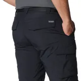 Short cargo de corte clásico, confeccionado en tejido técnico transpirable con protección solar UPF 50. Cuenta con cintura elástica lateral, bolsillos laterales, bolsillos para las manos y un bolsillo de seguridad con cierre de cremallera.
