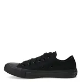 Championes Converse All Star de corte bajo, color negro monocromático, confeccionados en lona de algodón con suela de goma vulcanizada y cierre mediante cordones.
