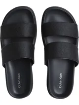 Sandalias negras tipo slide de doble tira con logo jacquard en relieve.