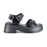 Sandalia de plataforma color marrón con hebillas ajustables.