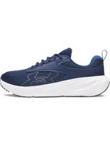 Championes Under Armour Surge 5 para running, de color azul marino con entresuela blanca y suela negra. Presentan parte superior de malla transpirable con superposiciones sintéticas y el logotipo de la marca en el lateral.