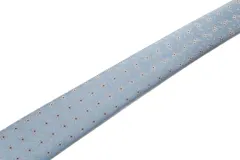 Corbata azul marino con textura de micro puntos y pañuelo de bolsillo a juego.