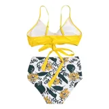 Conjunto de bikini de dos piezas de la marca Uniteduy, compuesto por un crop top amarillo liso con diseño cruzado y tirantes finos, y una bombacha de tiro alto con estampado floral y de hojas en tonos amarillos, verdes y blancos.