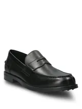 Mocasines Hush Puppies modelo Lucanos, de estilo clásico tipo penny loafer, confeccionados en cuero negro con costuras reforzadas y suela de goma.